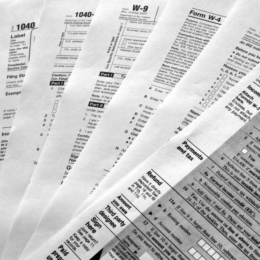 Various tax forms and documents laid out in a fan-like arrangement.